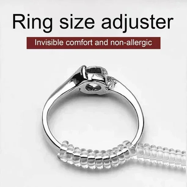 A silver ring size adjuster tool with a clear plastic ring being measured.