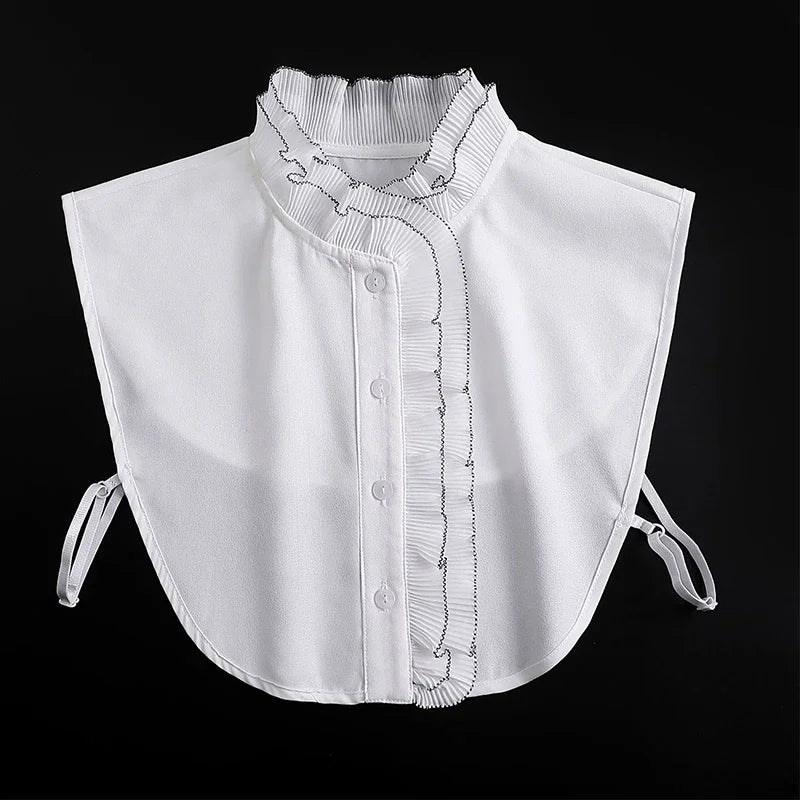 White blouse with a false collar and decorative stitching detail