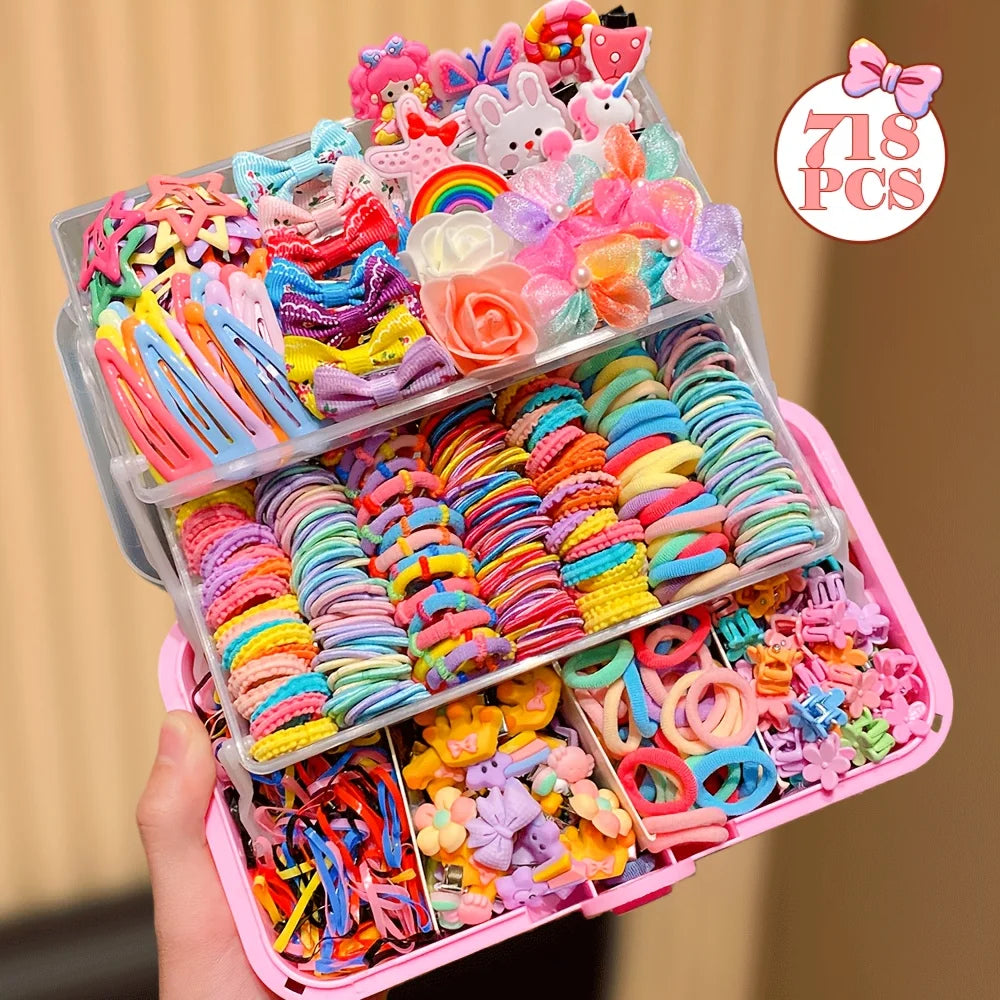 A clear plastic box filled with 718 colorful butterfly hair accessories in various shades of pink, purple, yellow, and blue.