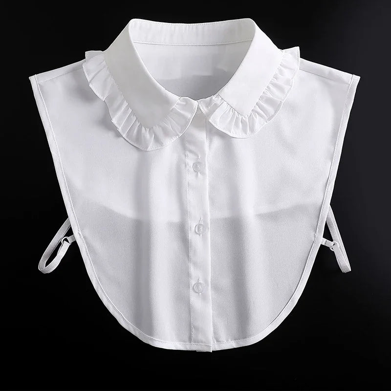 White blouse with a ruffled false collar and detachable neckline