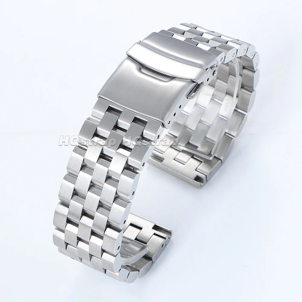 A silver adjustable stainless steel watch band shown from the side.