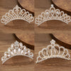 A set of sparkling crystal princess tiara hair combs for women shown in various angles on a wooden surface.