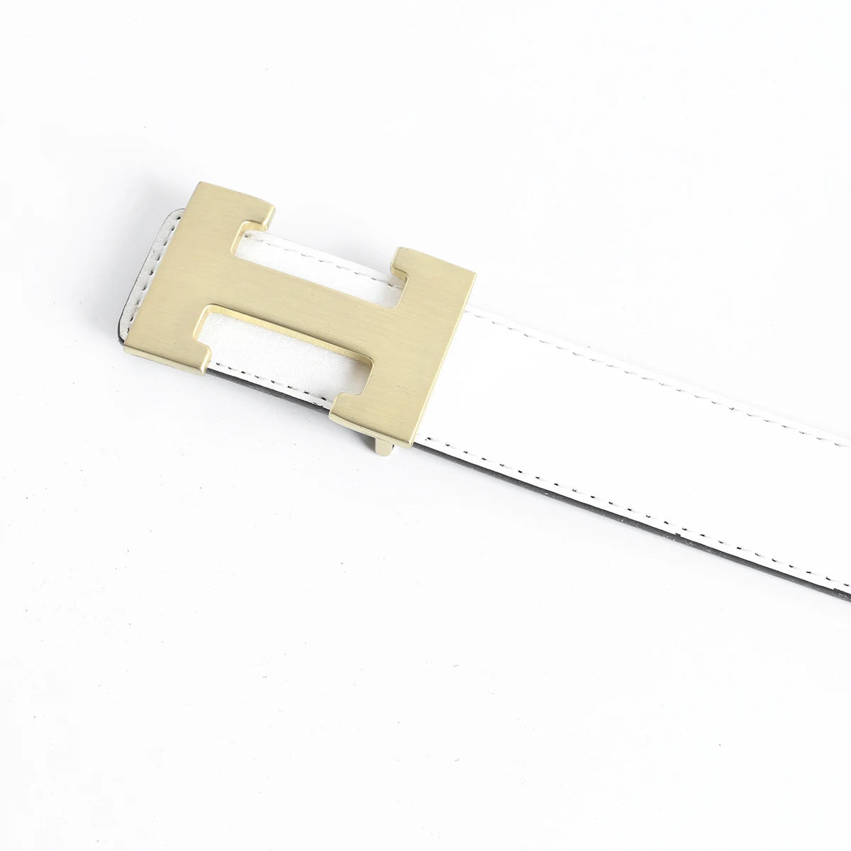 A close-up of a tan leather dress belt with a rectangular buckle and white stitching.