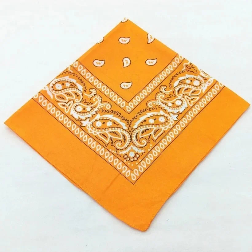 Orange cotton bandana scarf featuring white paisley embroidery and geometric patterns