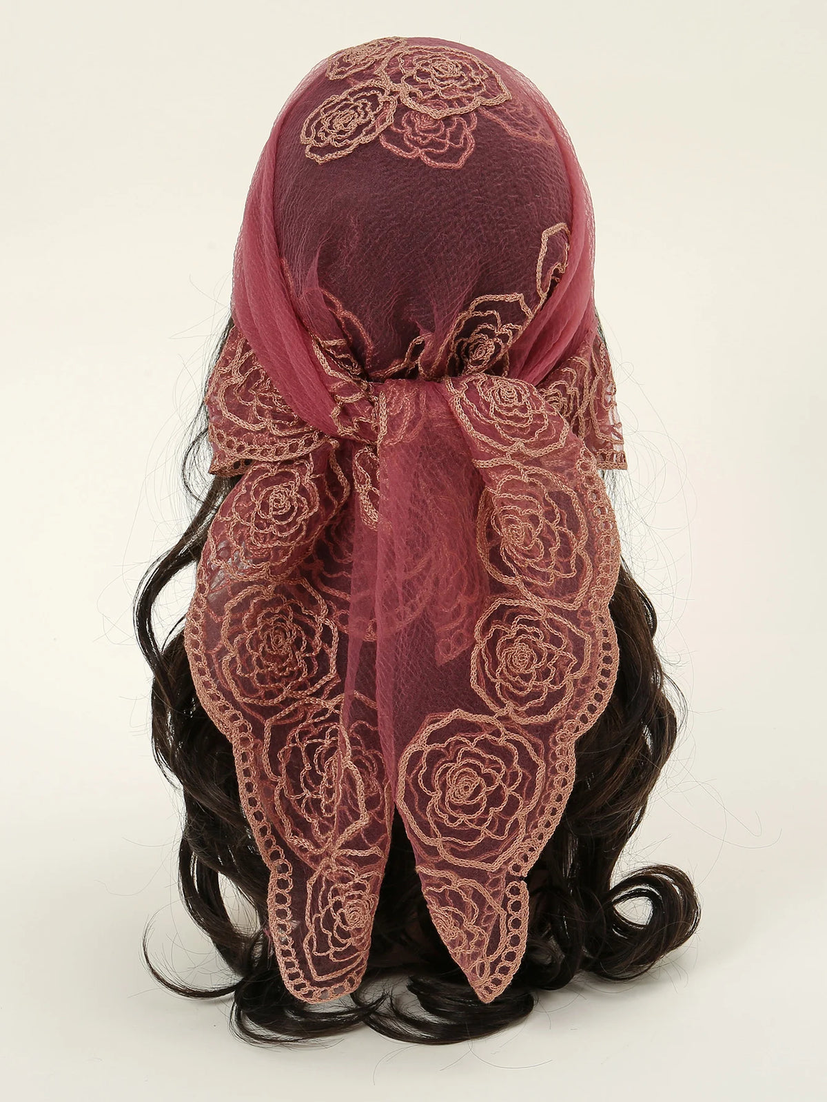 A deep maroon floral embroidered lace bandana headscarf tied around dark hair.