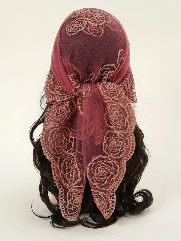 A deep maroon floral embroidered lace bandana headscarf tied around dark hair.