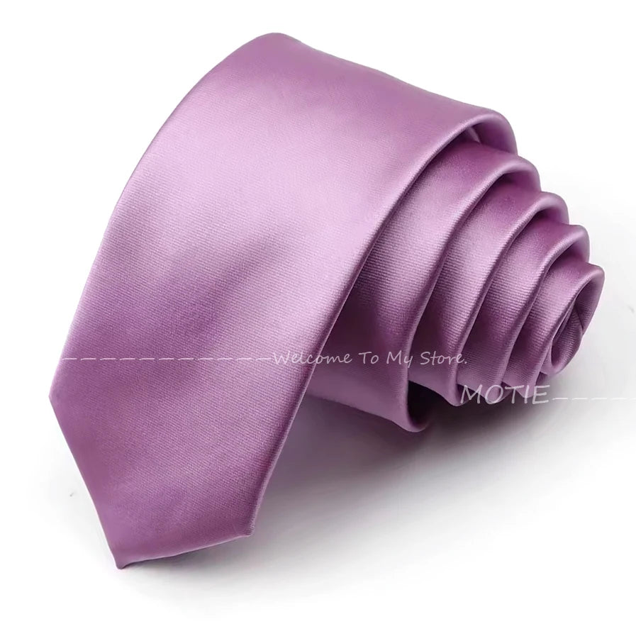 A lilac purple satin neck tie folded and displayed on a white background.