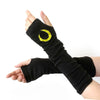 Black knitted fingerless gloves with a yellow circular design on the back of the hand