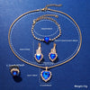 Gold chain necklace set featuring blue gemstones and a diamond-cut pendant