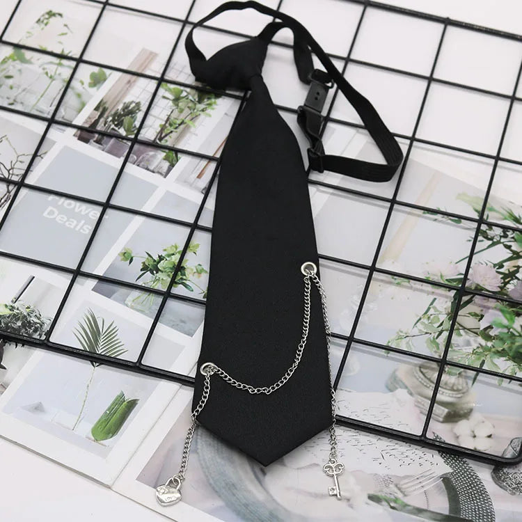 A black classic chain necktie is displayed against a grid background of various photos and greenery.