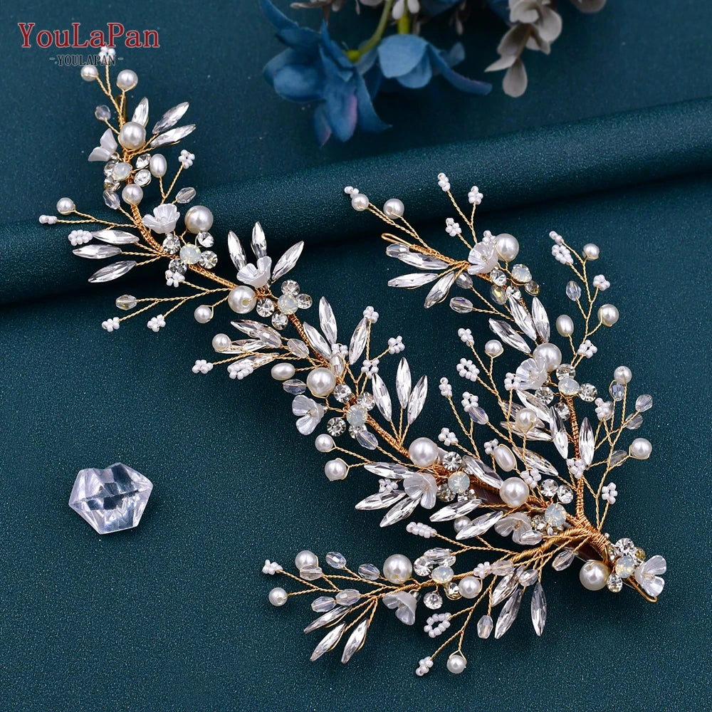A delicate bridal headpiece featuring white pearls and clear rhinestones arranged in a floral vine design.