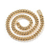 A gold stainless steel Cuban link necklace coiled in a circular pattern with a diamond accent clasp.