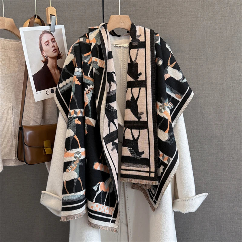 A black and beige plaid cashmere scarf and shawl wrap displayed on a hanger against a neutral gray background.