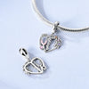 Sterling silver devil's eye charm bracelet featuring a heart pendant and floral accents
