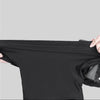 Black windproof dustproof ski mask and neck cover being held by a hand