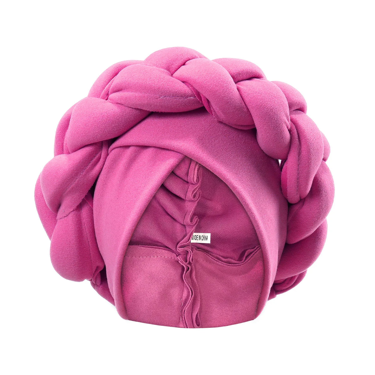 A pink, heavily braided turban cap for African party headwear.