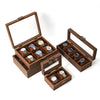 A wooden display box with multiple slots for showcasing watches and jewelry.