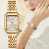 ساعة يد كوارتز بلون ذهبي بميناء مربع وسوار معدني مرتدية على معصم امرأة.