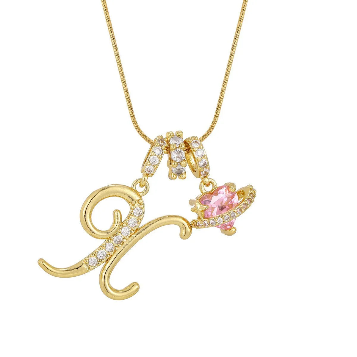 A gold letter pendant necklace featuring an initial charm and pink gemstone accents.