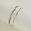 A set of two dainty stainless steel heart link bracelets for couples displayed against a light background.