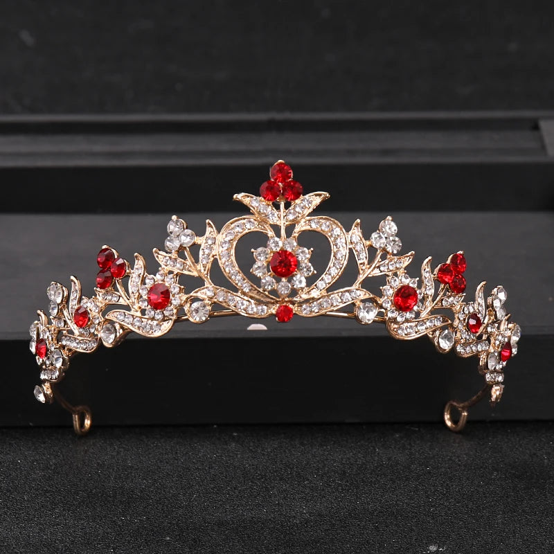 Gold crystal rhinestone bridal tiara headpiece featuring red gemstones and foliage