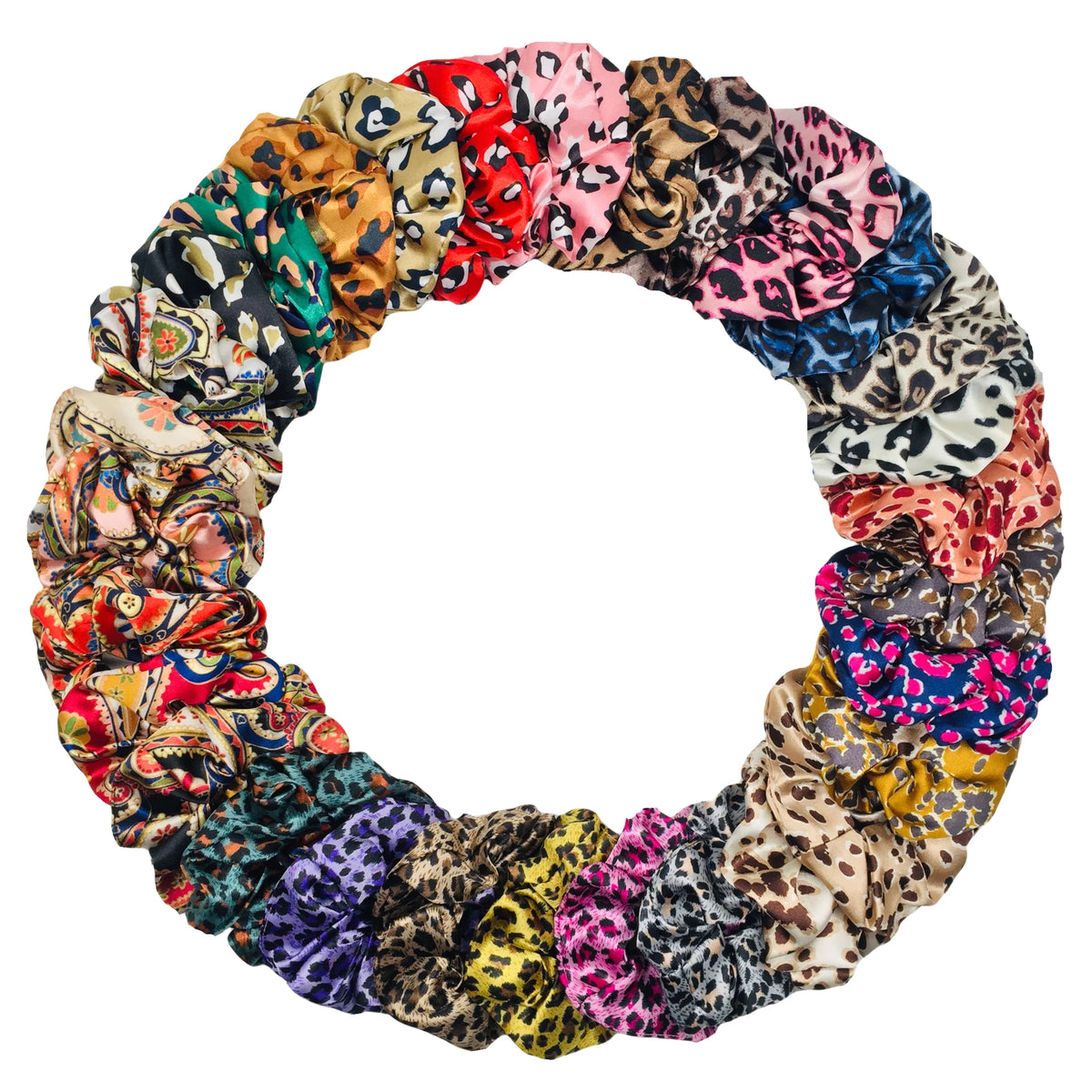 Disposición circular de seis gomas de pelo de satén con estampado floral en varios colores y patrones.