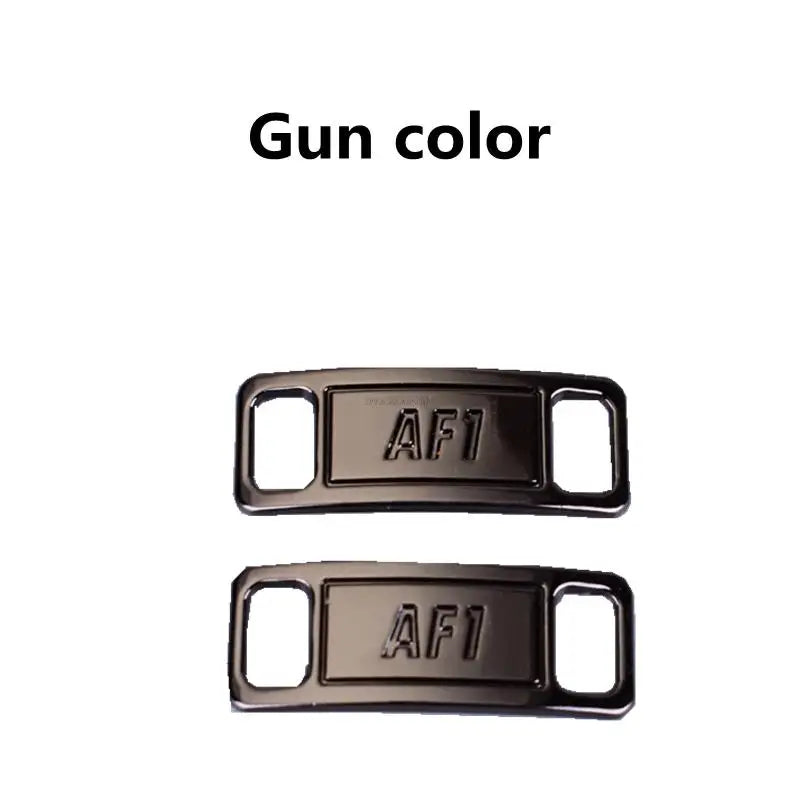 Two metallic gun color AF1 shoe charms or laces.
