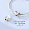 Sterling silver charm bracelet featuring paw print heart charms engraved with the message Your paw prints are forever on my h