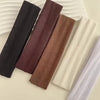 A collection of five solid colored fabric headbands for hair and fitness, including black, maroon, brown, beige, and light pu