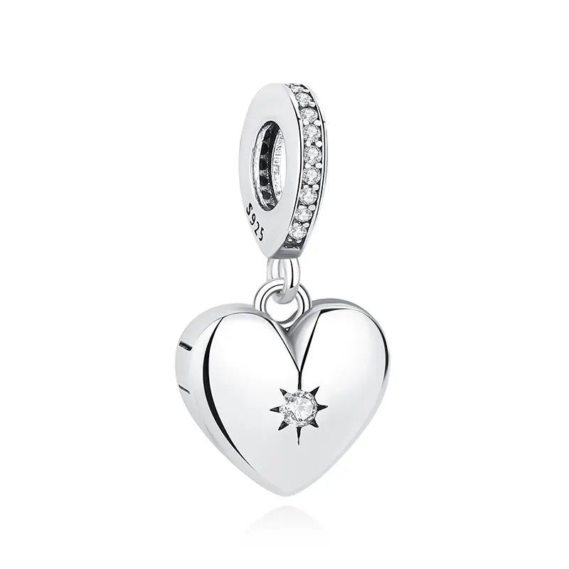 A silver heart pendant featuring a family tree design and surrounded by small diamonds.