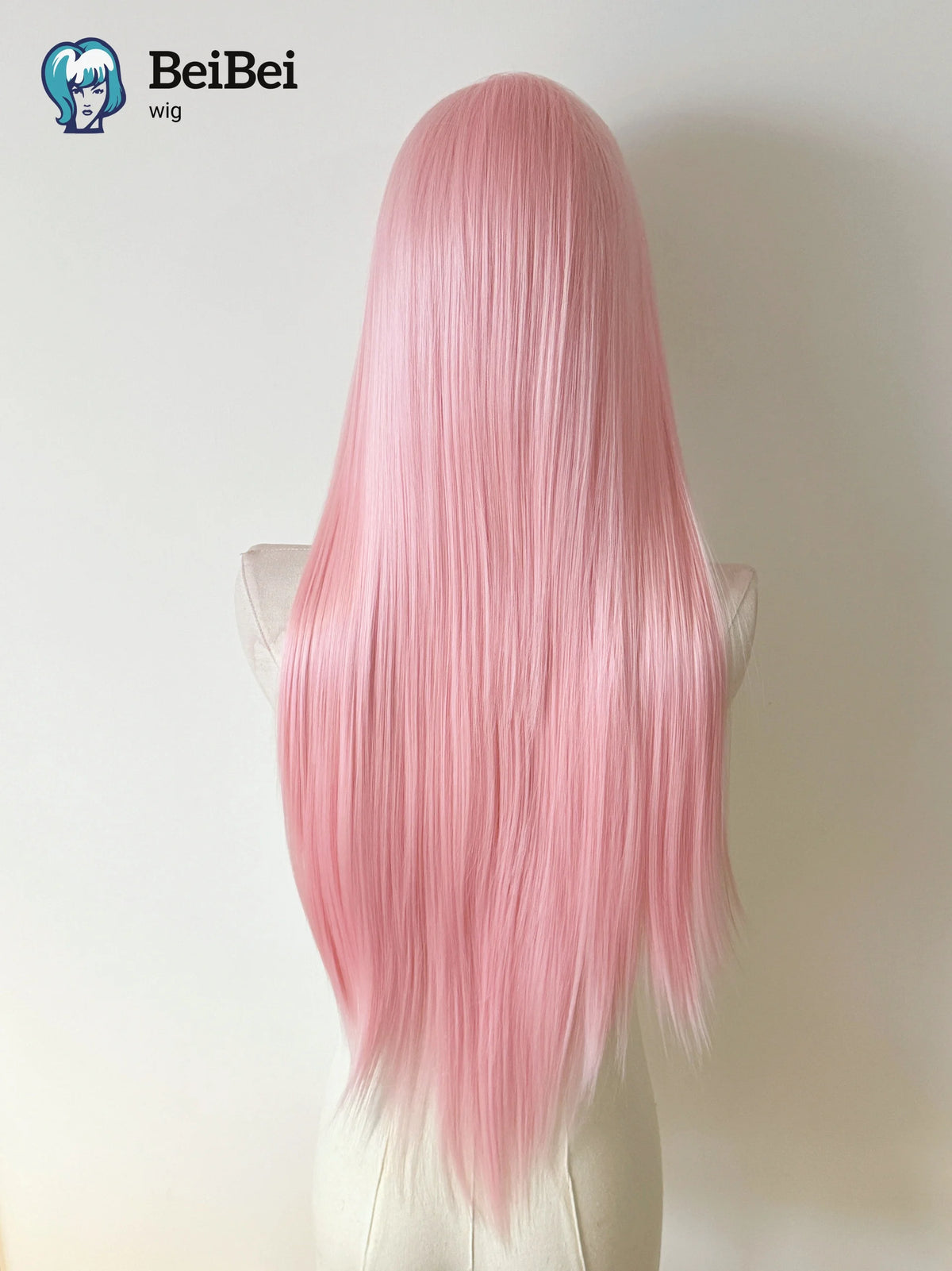 A long, straight, pink wig displayed on a mannequin.
