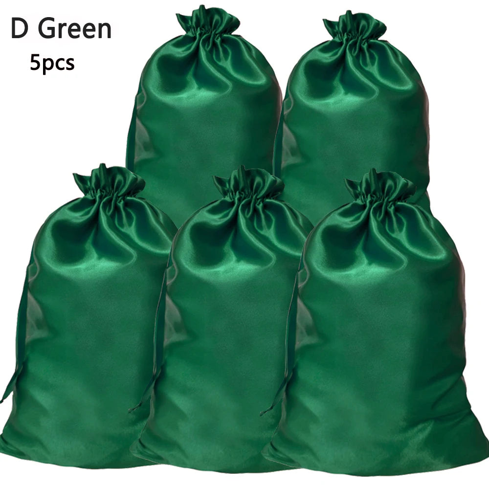 Five satin drawstring storage bags in a deep emerald green color