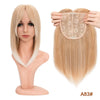 A model shows a straight blonde wig with bangs, and a separate hair topper is displayed on a bundle.