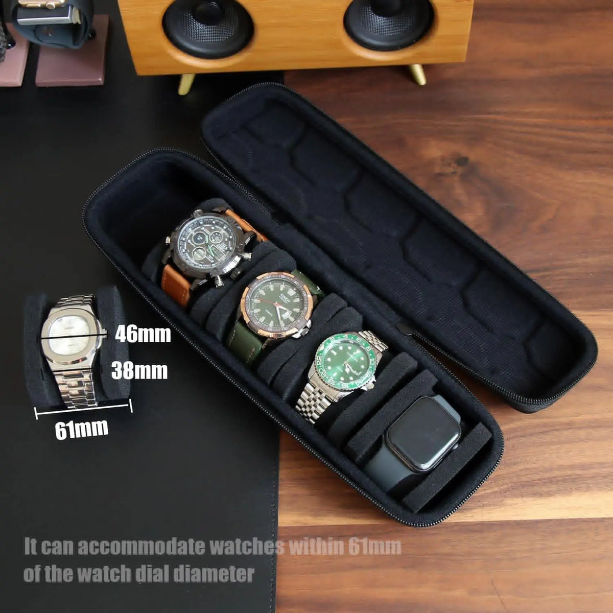 A black leather watch travel case organizer holding several wristwatches and a smartphone.