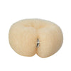 A light beige gauze hair bun tool with a silver ring, used for styling curly hair.