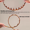 A flexible, transparent, textured hair band is shown being held by a hand.