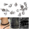 A collection of silver punk rock bullet rivets and decorative metal hardware for DIY crafting.