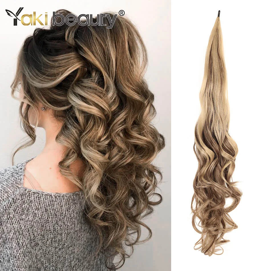 Long, wavy blonde hair extensions shown in a loose ponytail