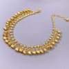 A gold bell foot chain anklet featuring small gold bells and clear stones.
