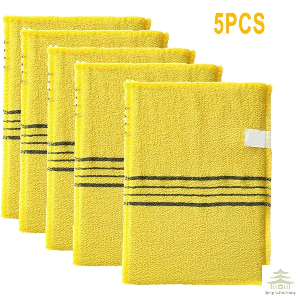 A set of five yellow exfoliating bath washcloths with black stripes.