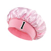 Pink satin hair cap with a black letter I print on the side