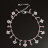 Silver stainless steel anklet featuring small pink rhinestone pendants.