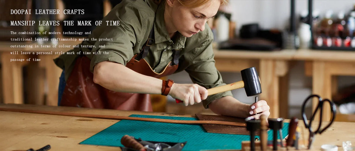 A person crafting leather goods using a hammer and tools on a wooden surface.