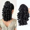 Black 14-inch claw clip ponytail extension for curly and wavy hair shown in a woman's hairstyle.