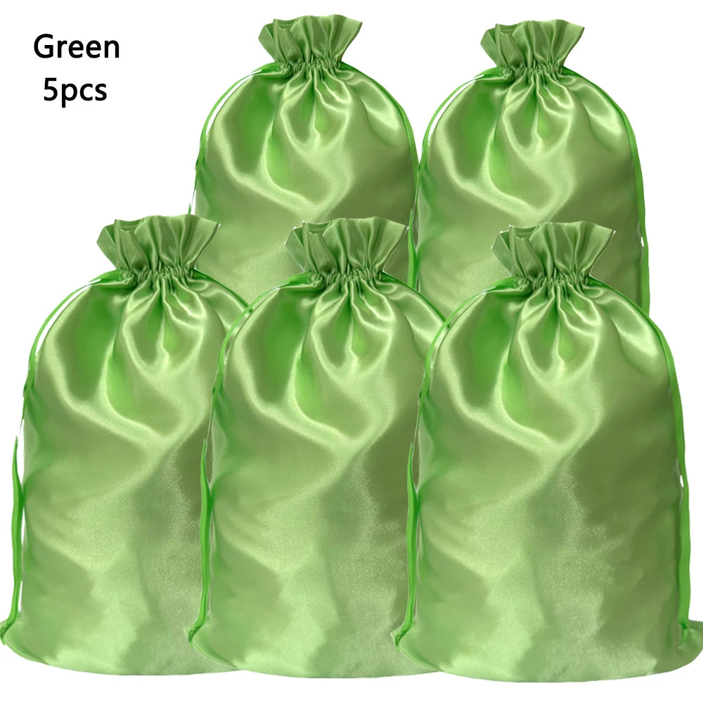 Five green satin drawstring storage bags for hair tools