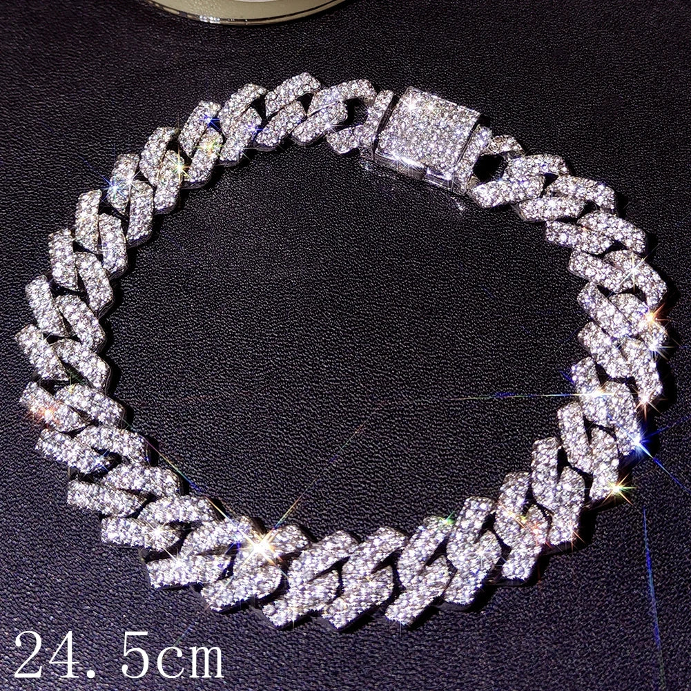 A close-up of a diamond-encrusted crystal Cuban link bracelet shown against a dark background.