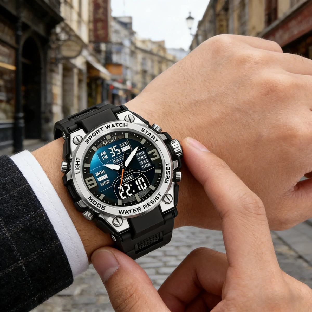 A close-up shot of a black multi-function digital wristwatch being held by a person outdoors.