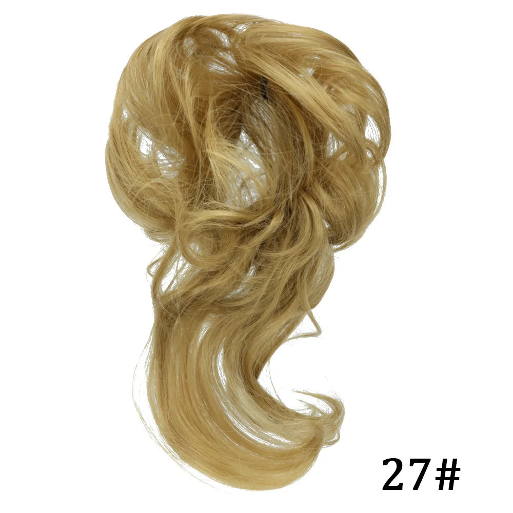 A bundle of light blonde synthetic hair, styled in a loose bun or ponytail, shown from the side.