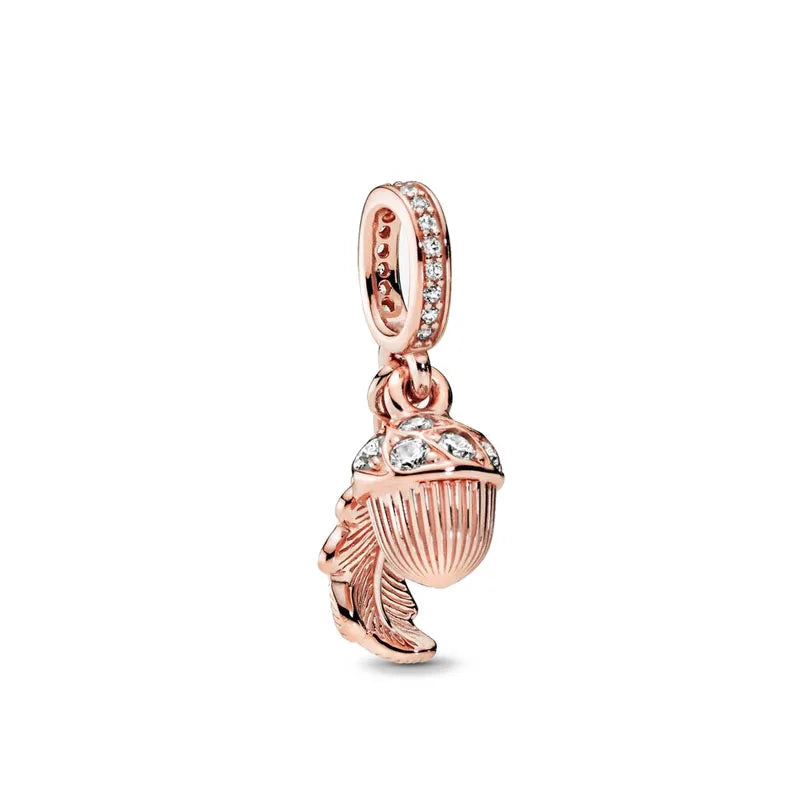 Rose gold cherry blossom charm pendant featuring a sparkling stone and leaf design.