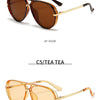 Paire de lunettes de pilot vintage à monture métallique brun et or, vues en angle de 45 degrés.